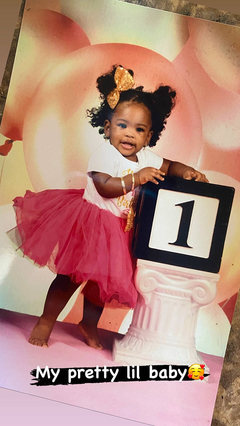 Riley is registered to the contest to win money with this photo: baby_toddler_clothing, child, day_dress, dress, entertainment, event, facial_expression, fashion_accessory, fashion_design, flash_photography, font, fun, happy, magenta, peach, performing_arts, person, pink, ruffle, smile