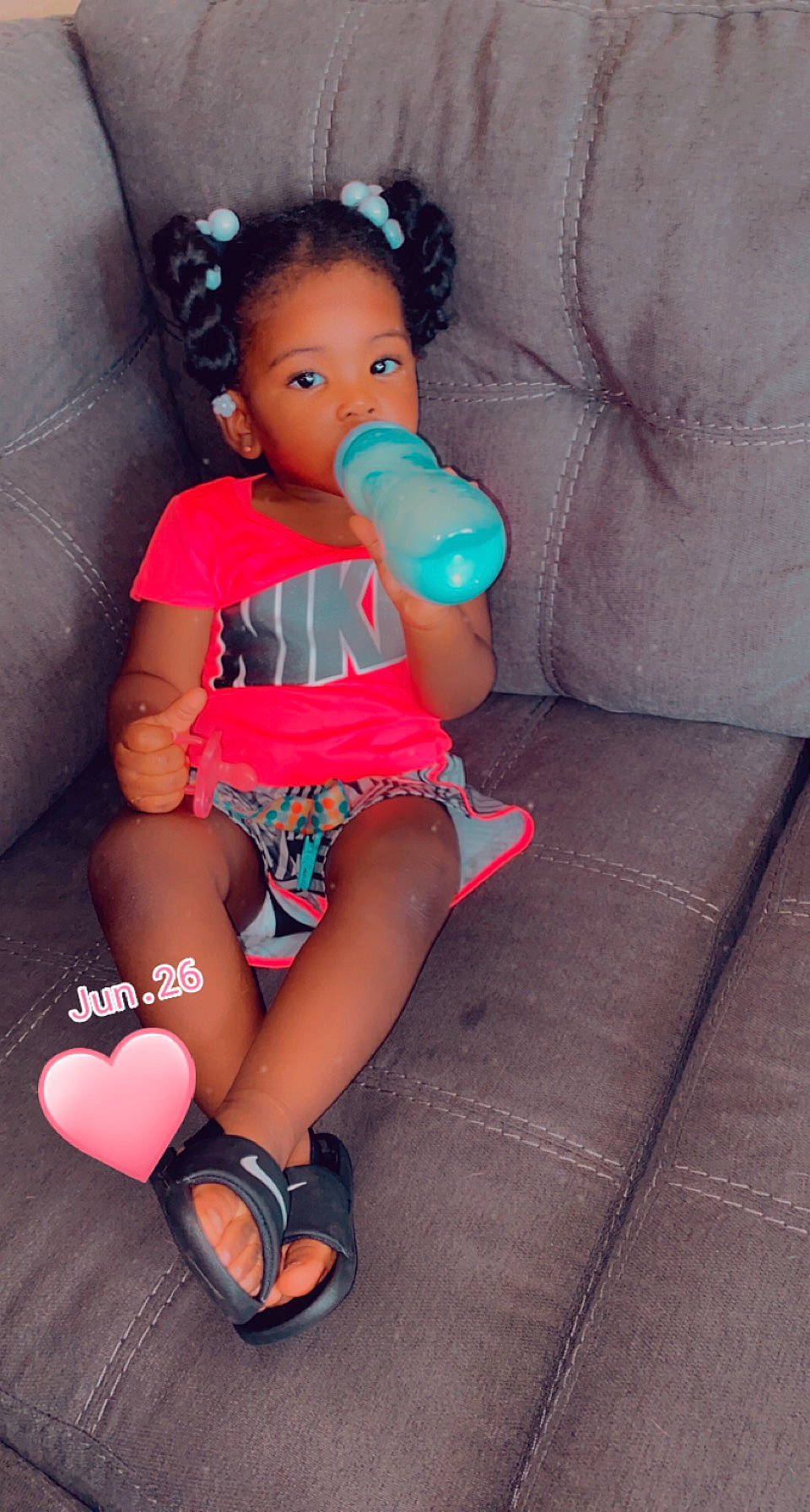 Riley is registered to the contest to win money with this photo: arm, baby_toddler_clothing, chest, comfort, couch, human_body, human_leg, joint, knee, leg, magenta, mouth, nail, neck, person, pink, shoulder, skin, sock, textile