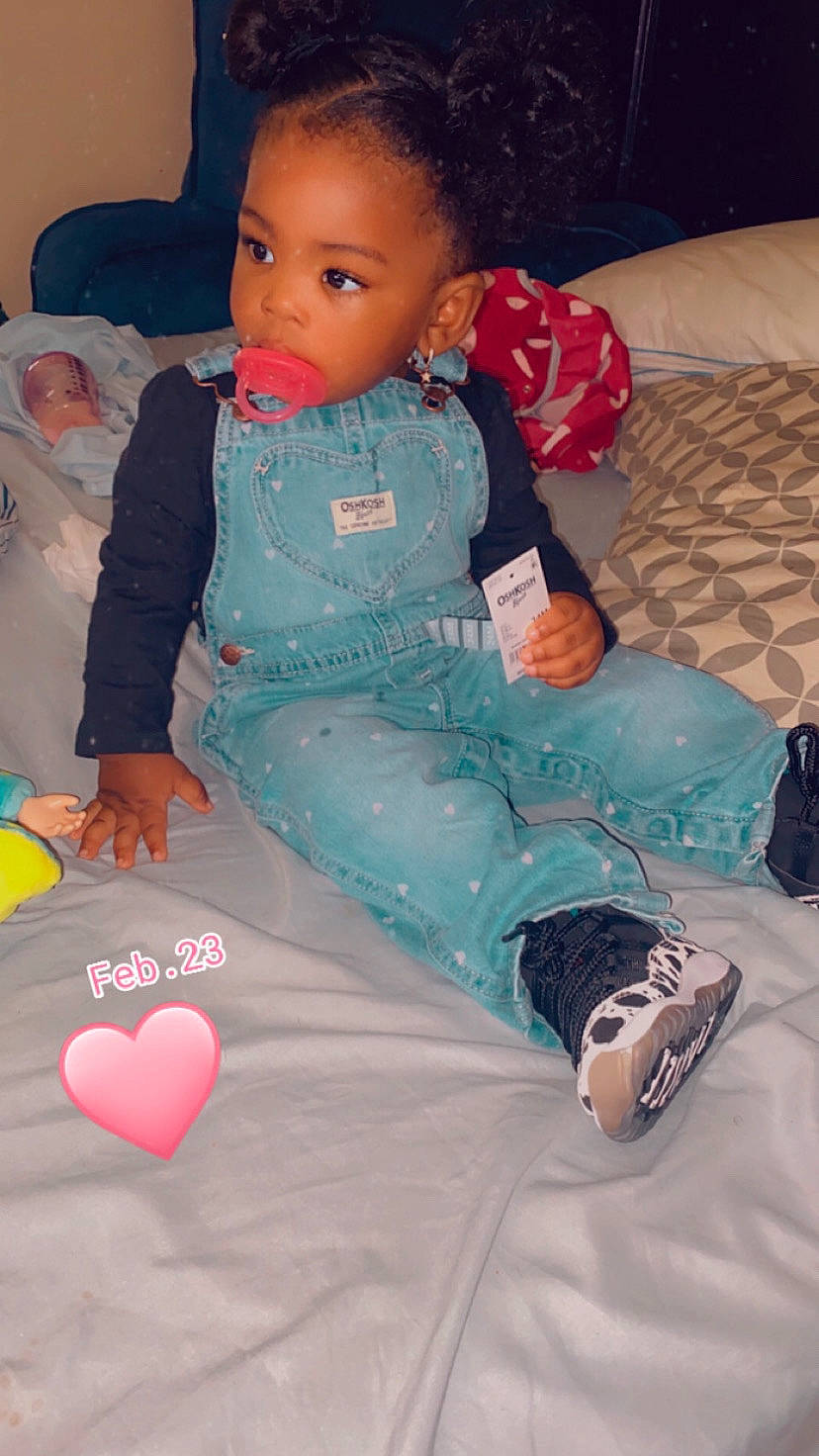 Riley is registered to the contest to win money with this photo: baby_toddler_clothing, beauty, child, dress, eye, flooring, fun, hairstyle, happy, head, leg, pattern, person, pink, skin, sleeve, sock, textile, thigh, toddler