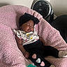 Kateri joined the competition — help win amazing prizes! baby, infant, sleeping, portrait, indoor, pink_blanket, chair, black_headband, bow, pacifier, baby_clothing, hearts, socks, fan, nursery, seated, relaxed, peaceful, close_up, child