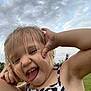 Chloe joined the competition — help win amazing prizes! bodypart, child, face, female, girl, grass, happy, head, laughing, mouth, nature, outdoors, person, photography, plant, portrait, sky, smile, summer, teeth