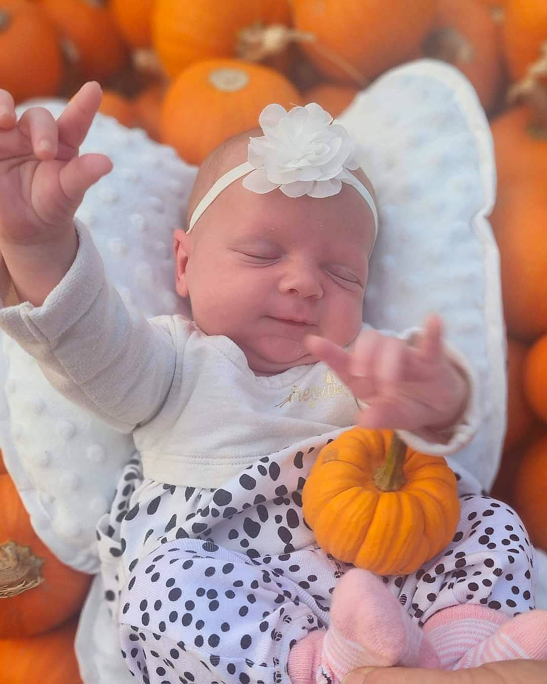 Kinzley joined the competition — help win amazing prizes! baby, baby_toddler_clothing, calabaza, child, cucurbita, facial_expression, gourd, grass, happy, hat, natural_foods, orange, person, plant, pumpkin, squash, toddler, vegetable, whole_food, winter_squash