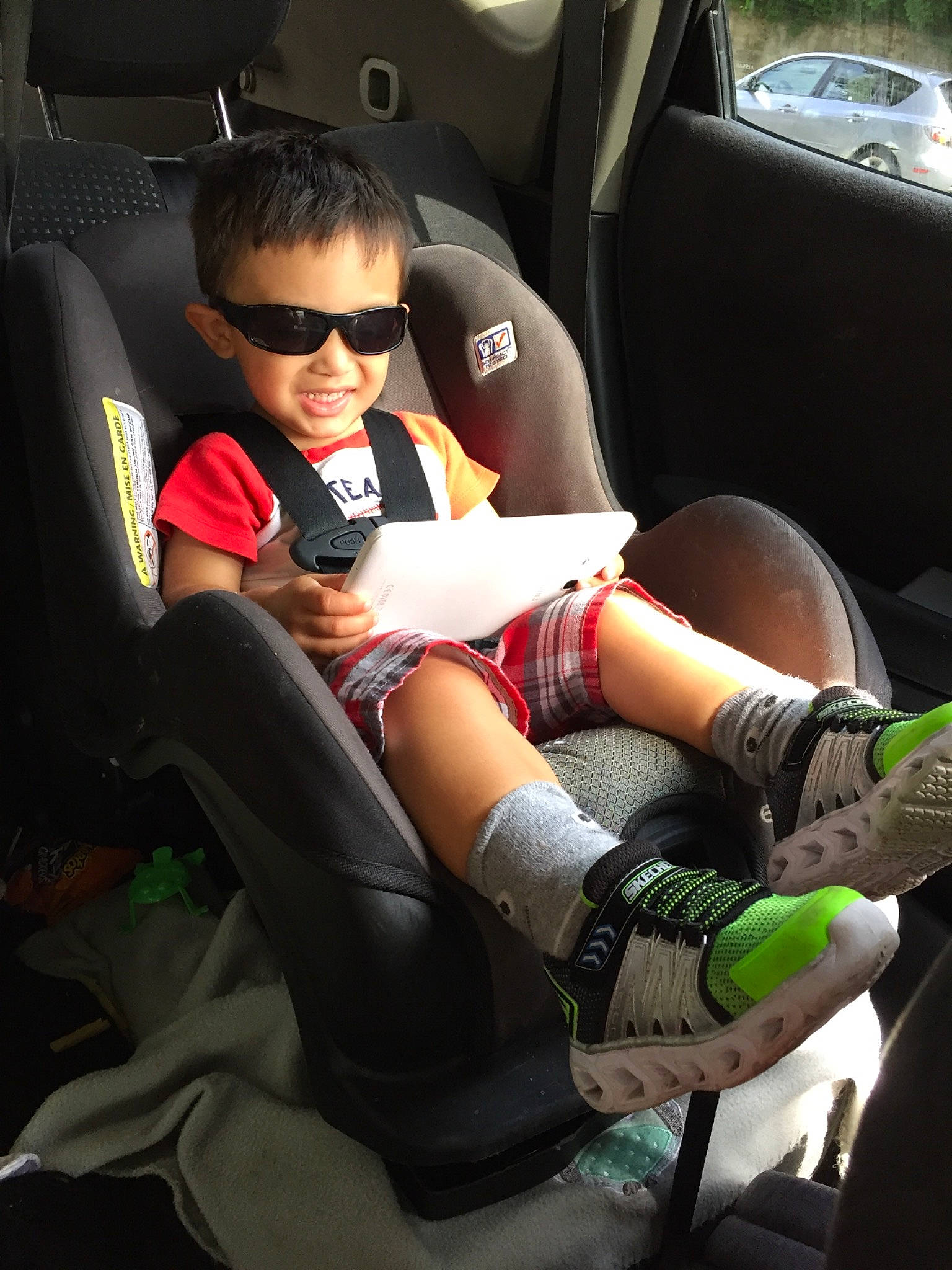 Kyden joined the competition — help win amazing prizes! arm, auto_part, car, car_seat, driving, eyewear, family_car, footwear, glasses, human_leg, joy, knee, leg, person, seat_belt, shoe, sitting, thigh, tights, vehicle