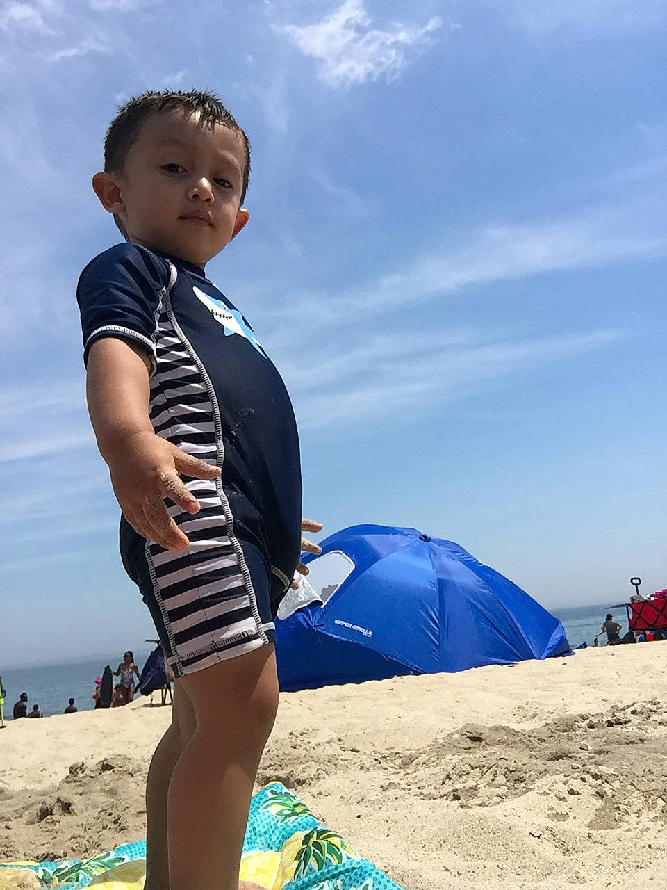 Kyden is registered to the contest to win money with this photo: beach, blue, child, fun, leg, ocean, person, play, sand, sea, sky, smile, summer, tourism, travel, vacation