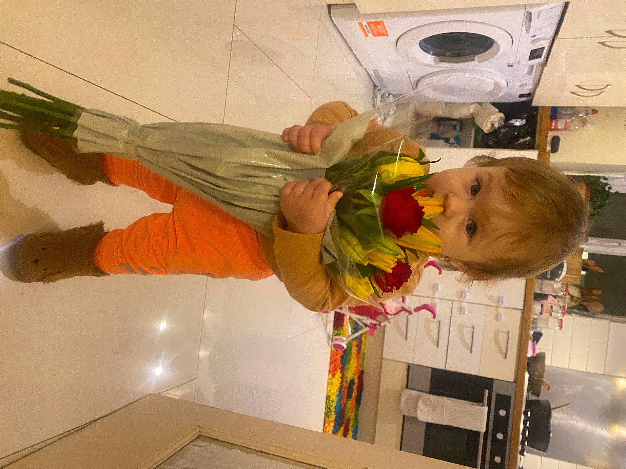 Carina joined the competition — help win amazing prizes! baby, ceiling, child, clothes_dryer, flower, fun, home_appliance, homemaker, kitchen, kitchen_appliance, laundry, laundry_room, machine, major_appliance, person, refrigerator, room, toddler, washing_machine, wood