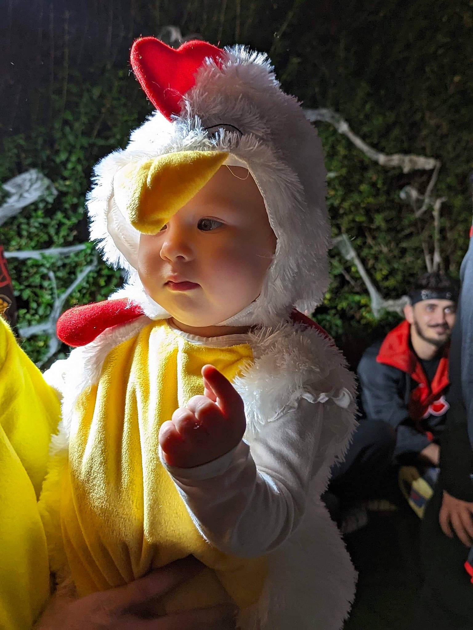Carina is registered to the contest to win money with this photo: baby, baby_toddler_clothing, cap, child, costume_hat, event, facial_expression, fashion_accessory, fun, gesture, grass, happy, hat, headband, headgear, headpiece, headwear, outerwear, person, plant