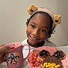 Taisha is registered to the contest to win money with this photo: child, smiling, portrait, indoor, breakfast, food, toast, fruit, strawberries, mango, chocolate, plate, mug, pink, teddy_bear, headband, table, kitchen, curly_hair, happy