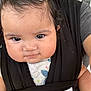 Helena is registered to the contest to win money with this photo: baby, child, face, person, closeup, carrier, clothing, cheeks, cute, infant, portrait, human, black, pattern, butterfly, skin, eyes, hair, adult, holding