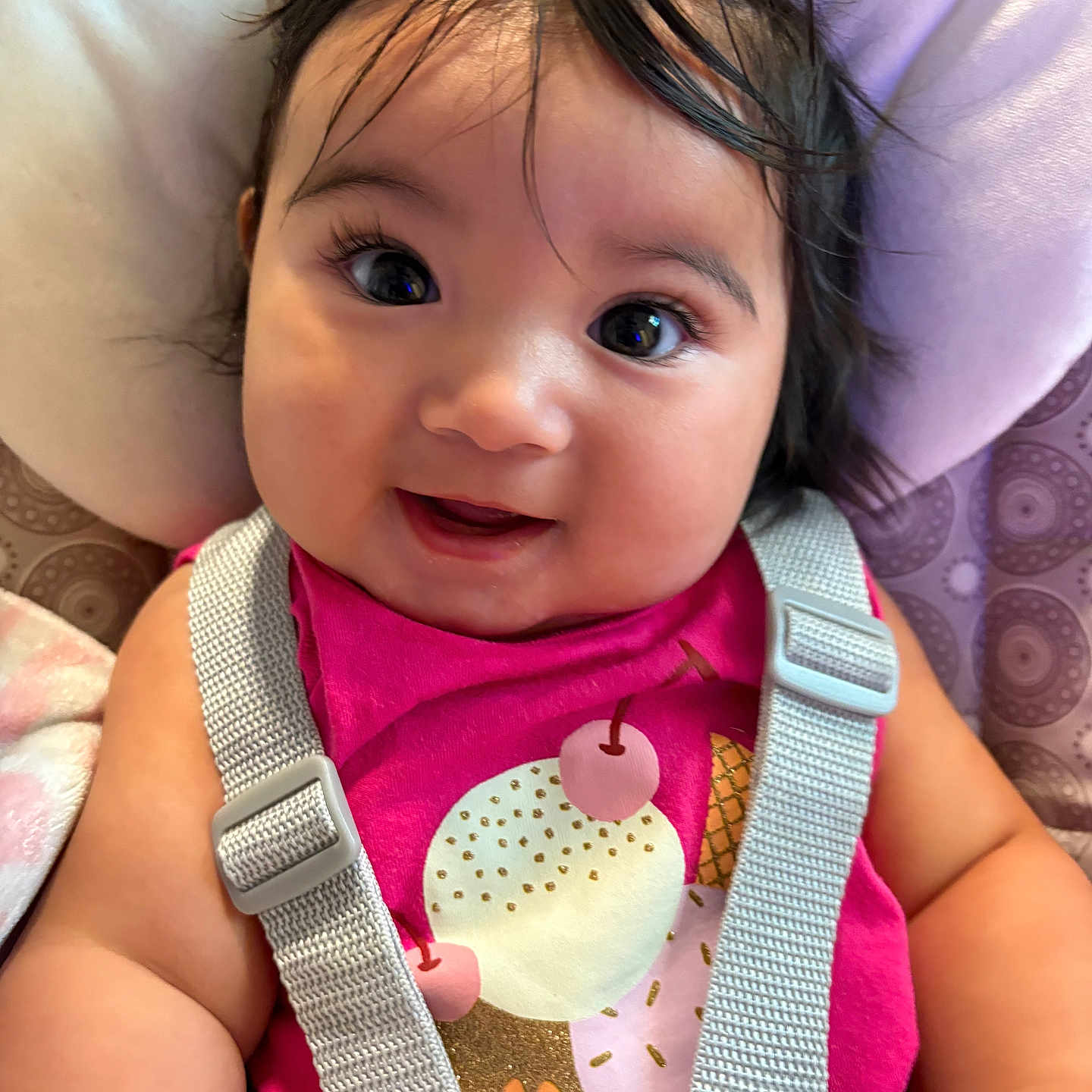 Helena joined the competition — help win amazing prizes! baby, blanket, car_seat, child, closeup, clothing, cute, face, hair, happy, indoors, infant, person, pink_shirt, portrait, seat, seatbelt, skin, smiling, young_child