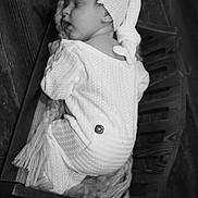 Renesemae Raiyne joined the competition — help win amazing prizes! baby, sleeping, knitted_clothing, hat, wooden_cradle, blanket, black_and_white, infant, cozy, cute, peaceful, portrait, indoor, soft_texture, newborn, child, resting, sleep, warm, comfort