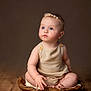 baby, child, infant, blue_eyes, headband, pearl, beige_outfit, wooden_bowl, wooden_floor, sitting, curious, portrait, indoor, soft_lighting, background, cute, chubby, button, skin, studio_photo
