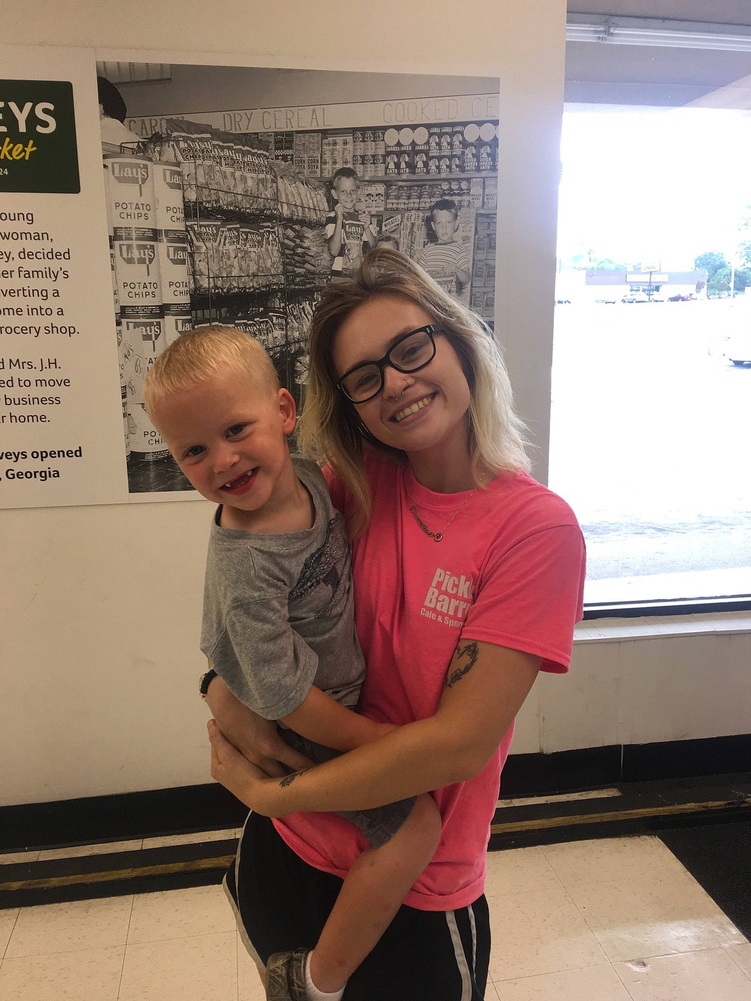 Trace is registered to the contest to win money with this photo: adaptation, child, community, event, fun, glasses, joint, joy, leisure, person, pink, room, shoulder, t_shirt, vacation