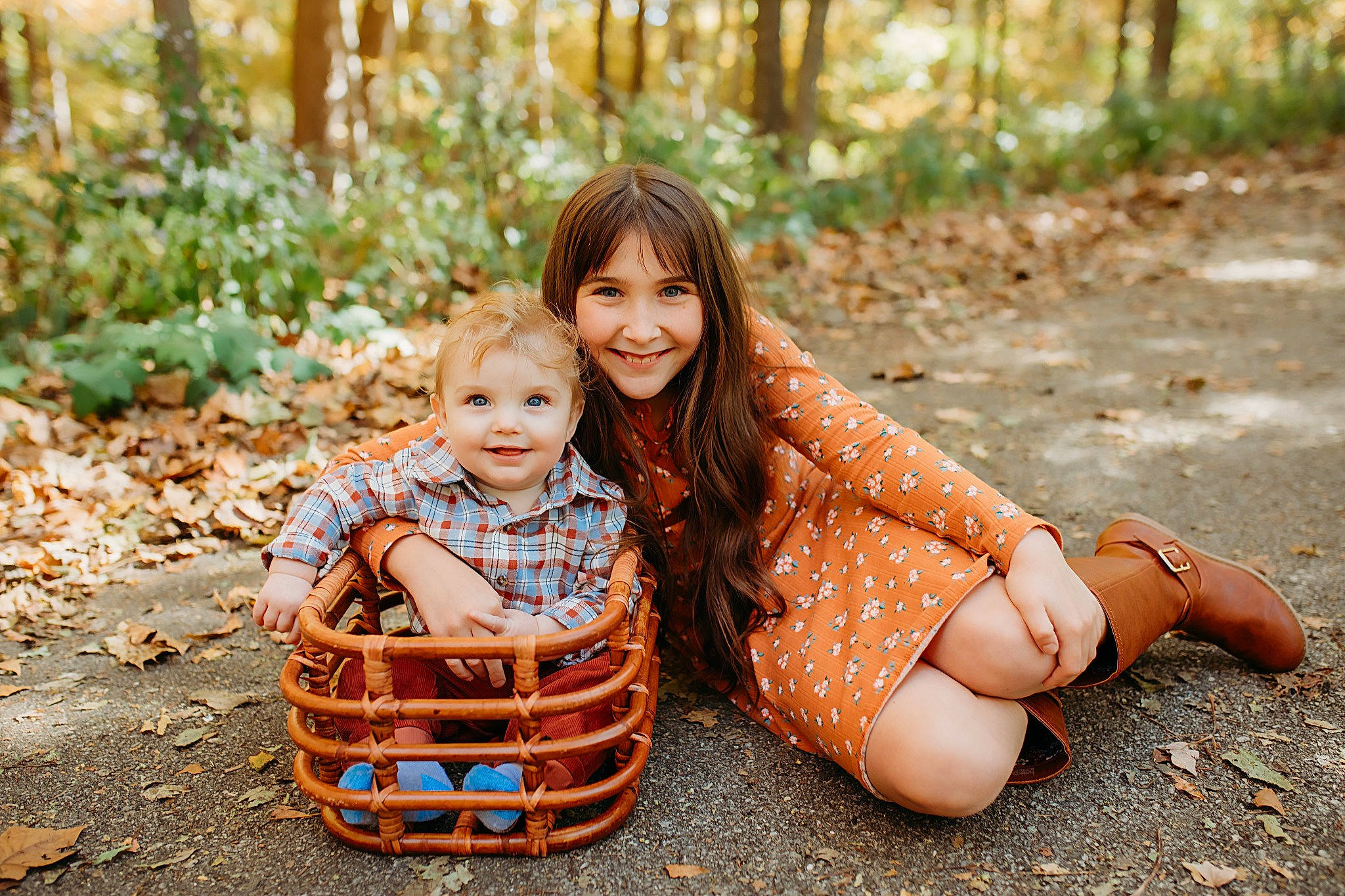 Khav is registered to the contest to win money with this photo: baby, brown_hair, child, dress, fun, grass, happy, human_leg, joy, leaf, leisure, pattern, people_in_nature, person, plant, sitting, smile, spring, sunlight, toddler