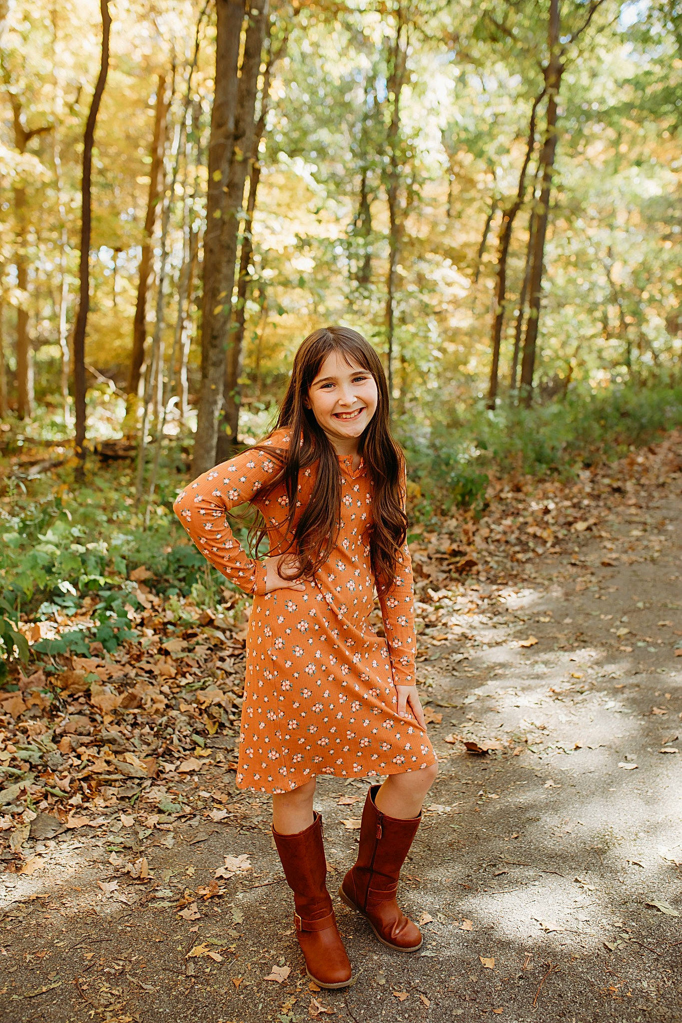 Khav is registered to the contest to win money with this photo: branch, brown_hair, fawn, forest, grass, happy, human_leg, joy, leaf, long_hair, morning, natural_landscape, pattern, people_in_nature, person, plaid, plant, smile, tartan, thigh