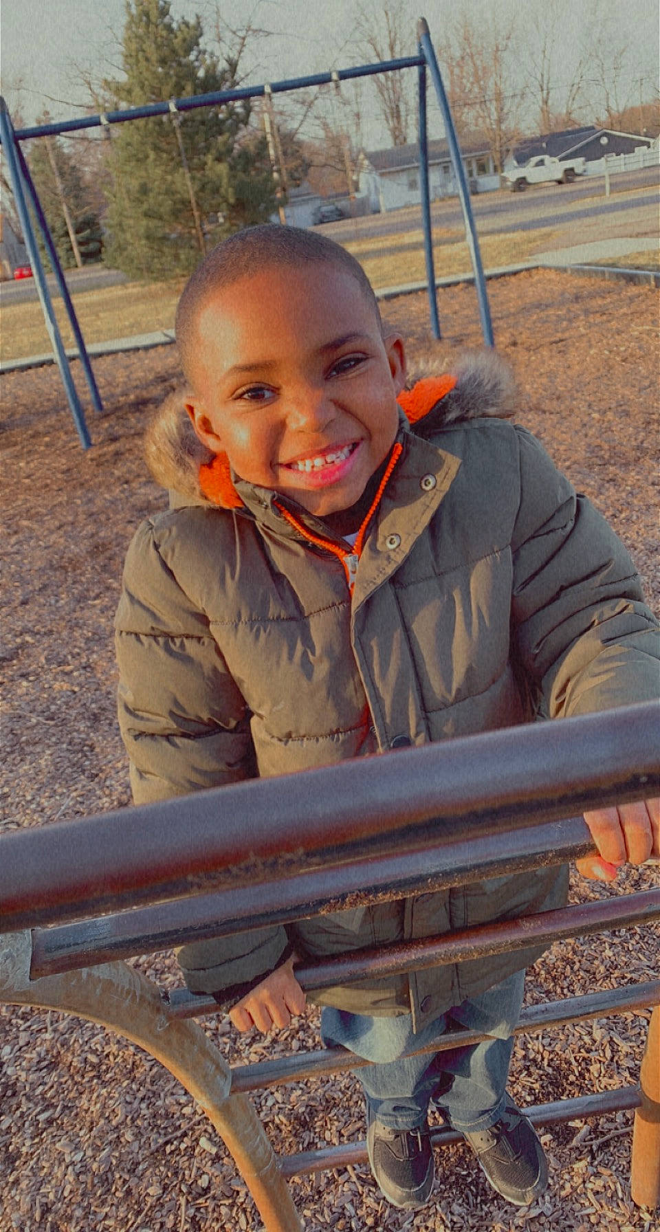 Jace joined the competition — help win amazing prizes! child, city, eye, fun, grass, happy, joy, landscape, leisure, outdoor_play_equipment, person, playground, recreation, roof, sitting, skin, smile, soil, swing, toddler