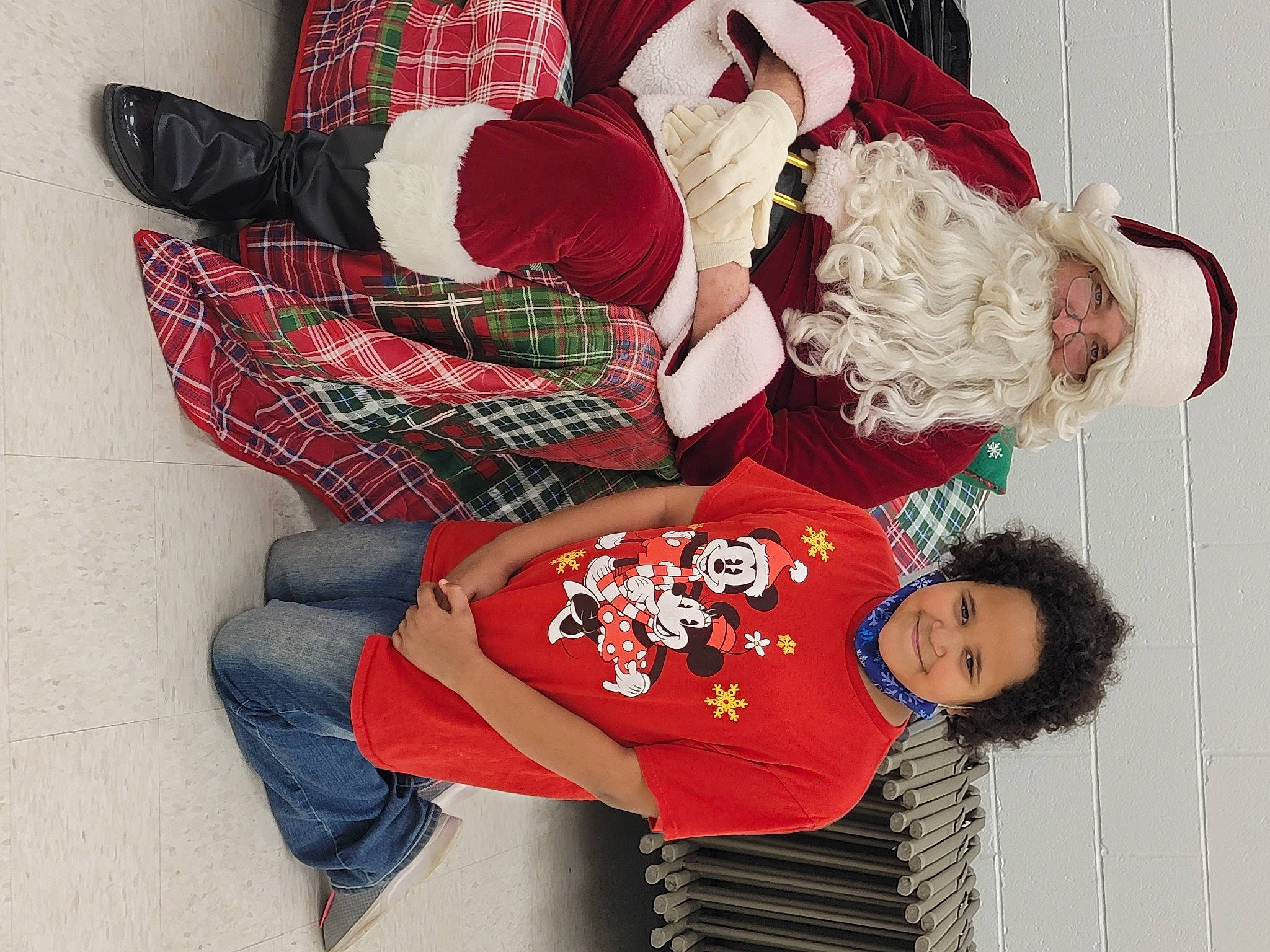 Athena joined the competition — help win amazing prizes! carmine, christmas_decoration, comfort, event, fictional_character, fur, happy, hat, headwear, holiday, joy, lap, pattern, person, plaid, red, santa_claus, sleeve, tartan, textile