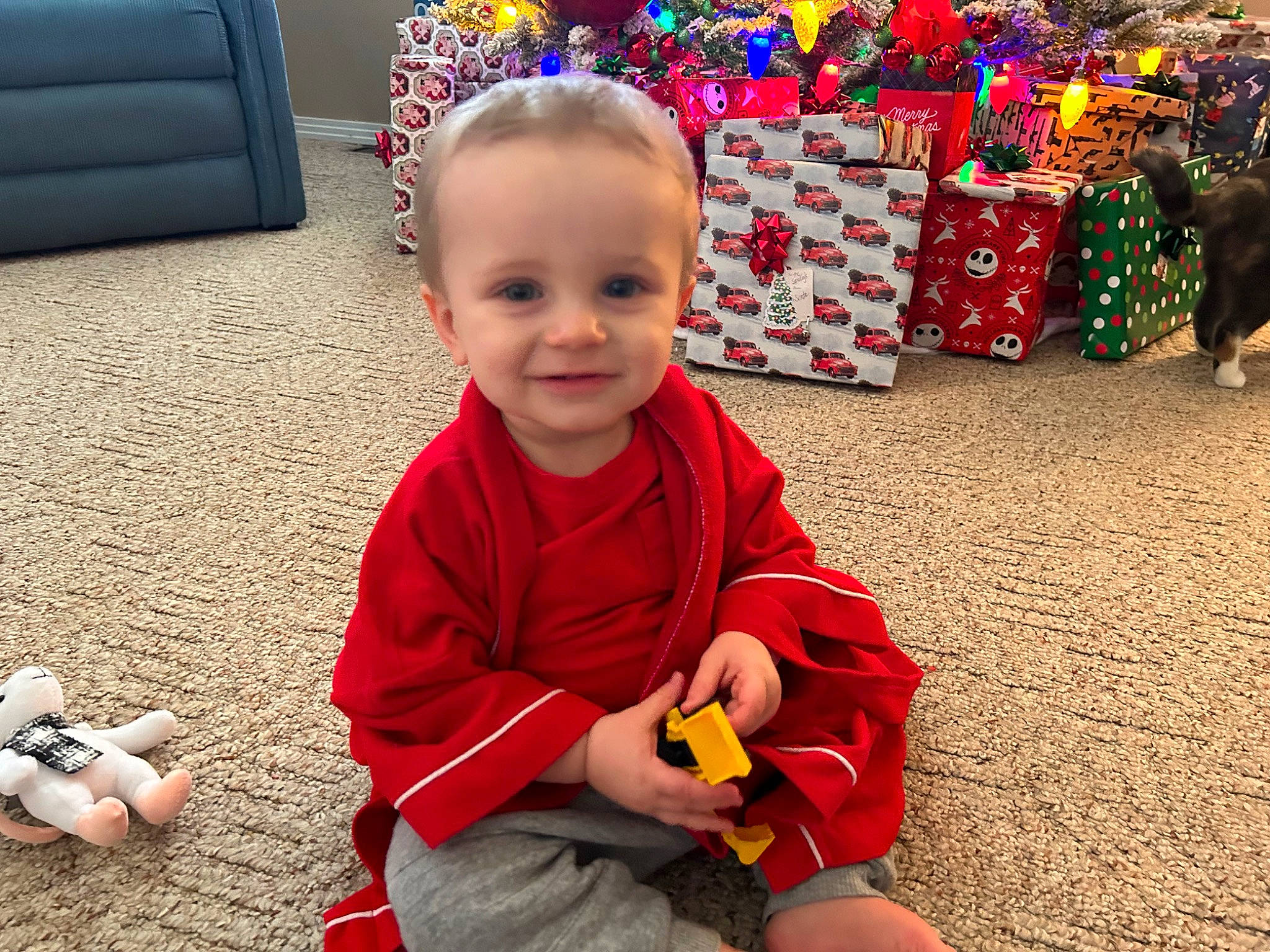 Leo joined the competition — help win amazing prizes! baby, baby_toddler_clothing, child, event, facial_expression, flooring, fun, happy, human_leg, joy, person, play, red, sitting, skin, smile, snapshot, standing, thumb, toddler