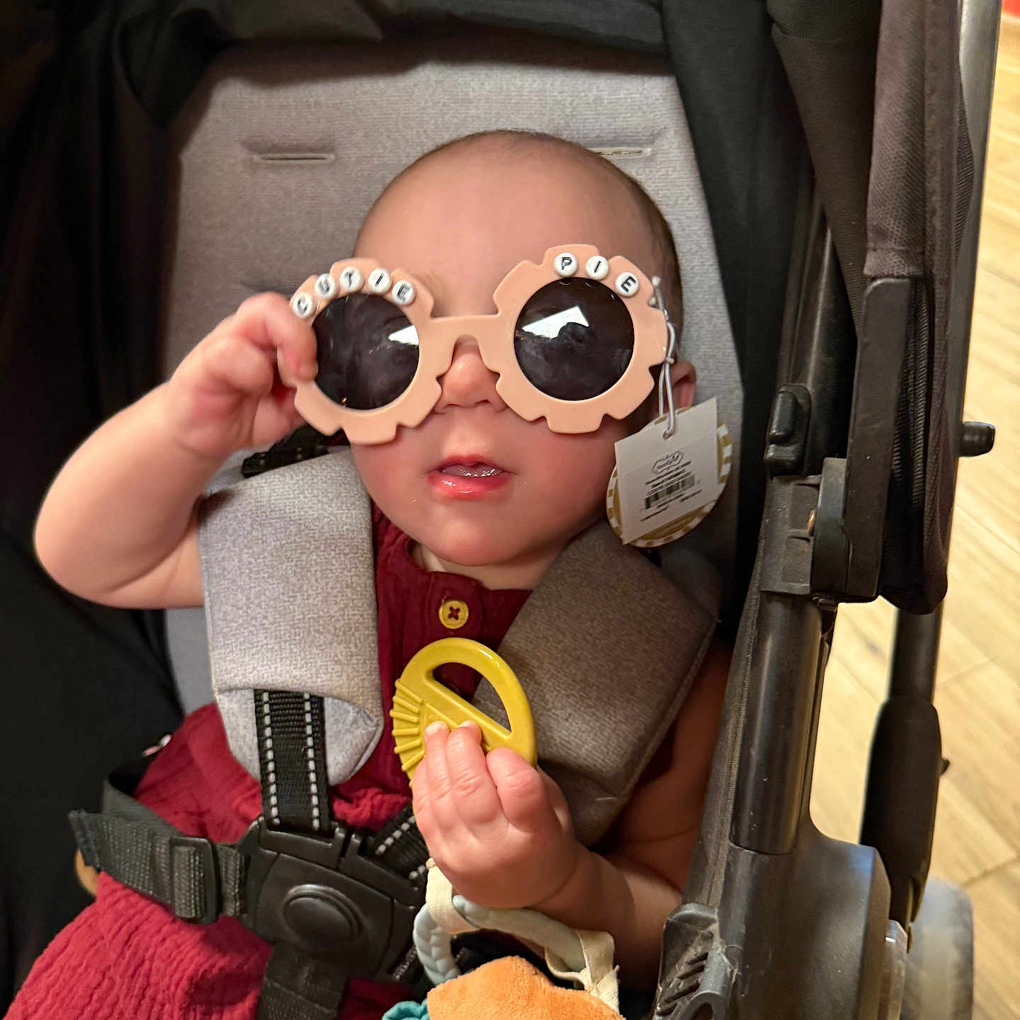 Raelynn Marie joined the competition — help win amazing prizes! accessory, baby, casual, child, clothing, colorful, comfort, cute, expression, face, hand, head, indoor, infant, person, playful, seatbelt, stroller, sunglasses, toy
