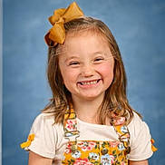 Brylynn Ann Dawn is registered to the contest to win money with this photo: child, girl, smiling, yellow_bow, floral_overall, white_shirt, portrait, studio_background, happy, cute, youth, innocence, fashion, hair_accessory, childhood, person, bright_colors, casual_clothing, posing, photography