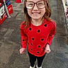 Brylynn Ann Dawn is registered to the contest to win money with this photo: candid, carpet, casual, child, eyewear, full_body, girl, glasses, happy, heart_pattern, portrait, red_shirt, retail, shelves, shopping, smile, sneakers, standing, store_aisle, teeth