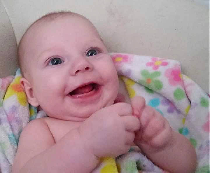 Alexis is registered to the contest to win money with this photo: baby, baby_toddler_clothing, cheek, chin, eye, eyebrow, face, finger, gesture, happy, head, iris, lip, mouth, nose, person, pink, skin, smile, textile