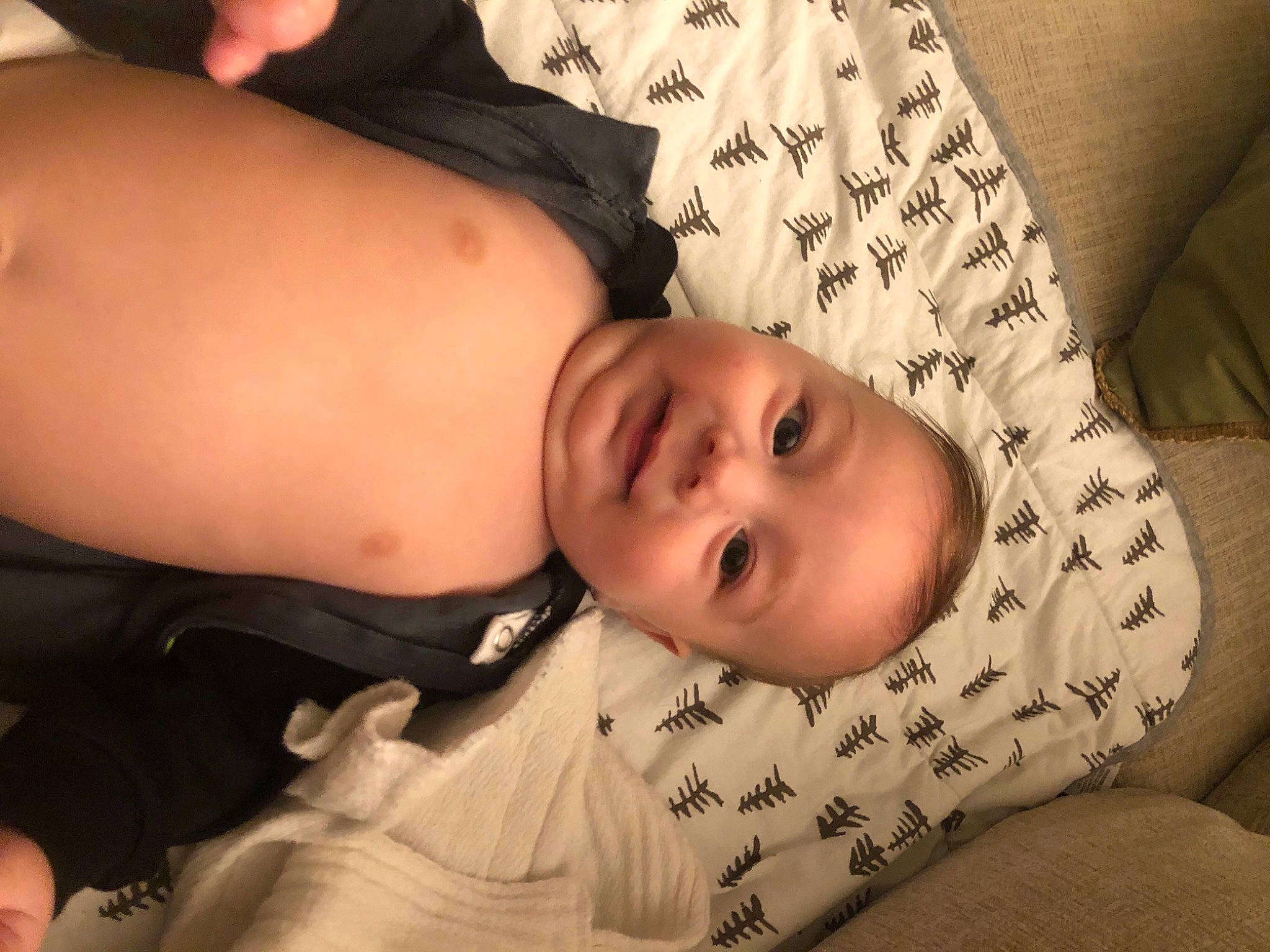 Griffin is registered to the contest to win money with this photo: arm, cheek, chin, comfort, elbow, eye, eyebrow, finger, flash_photography, glasses, head, joint, lip, mouth, muscle, nose, person, skin, sleeve, toddler