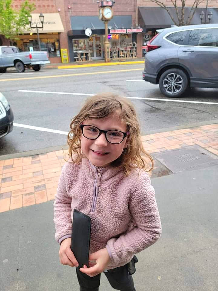 Savanna is registered to the contest to win money with this photo: asphalt, automotive_design, car, cool, eyewear, fashion, gesture, hair, hairstyle, joy, land_vehicle, motor_vehicle, person, photograph, road_surface, sleeve, smile, tire, vehicle, vision_care