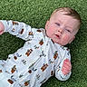 Boston joined the competition — help win amazing prizes! baby, infant, onesie, grass, outdoor, cute, child, face, expression, blue_eyes, hand, lying_down, nature, green, animal_print, sleepwear, portrait, soft_lighting, young_child, casual