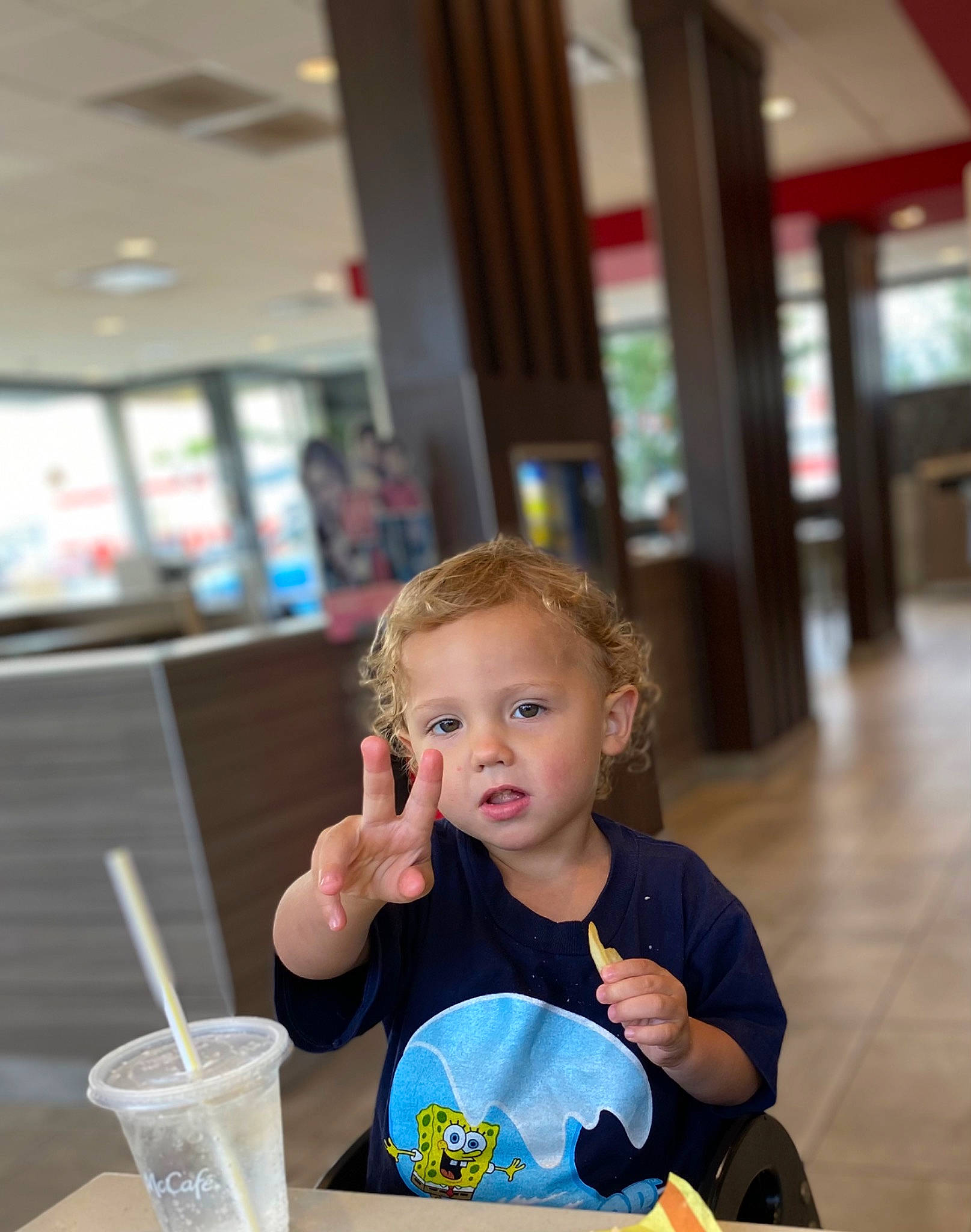Braxton joined the competition — help win amazing prizes! chair, child, desk, drink, drinking_straw, eating, flooring, fun, happy, learning, leisure, office_supplies, person, plate, recreation, room, sitting, table, tableware, toddler