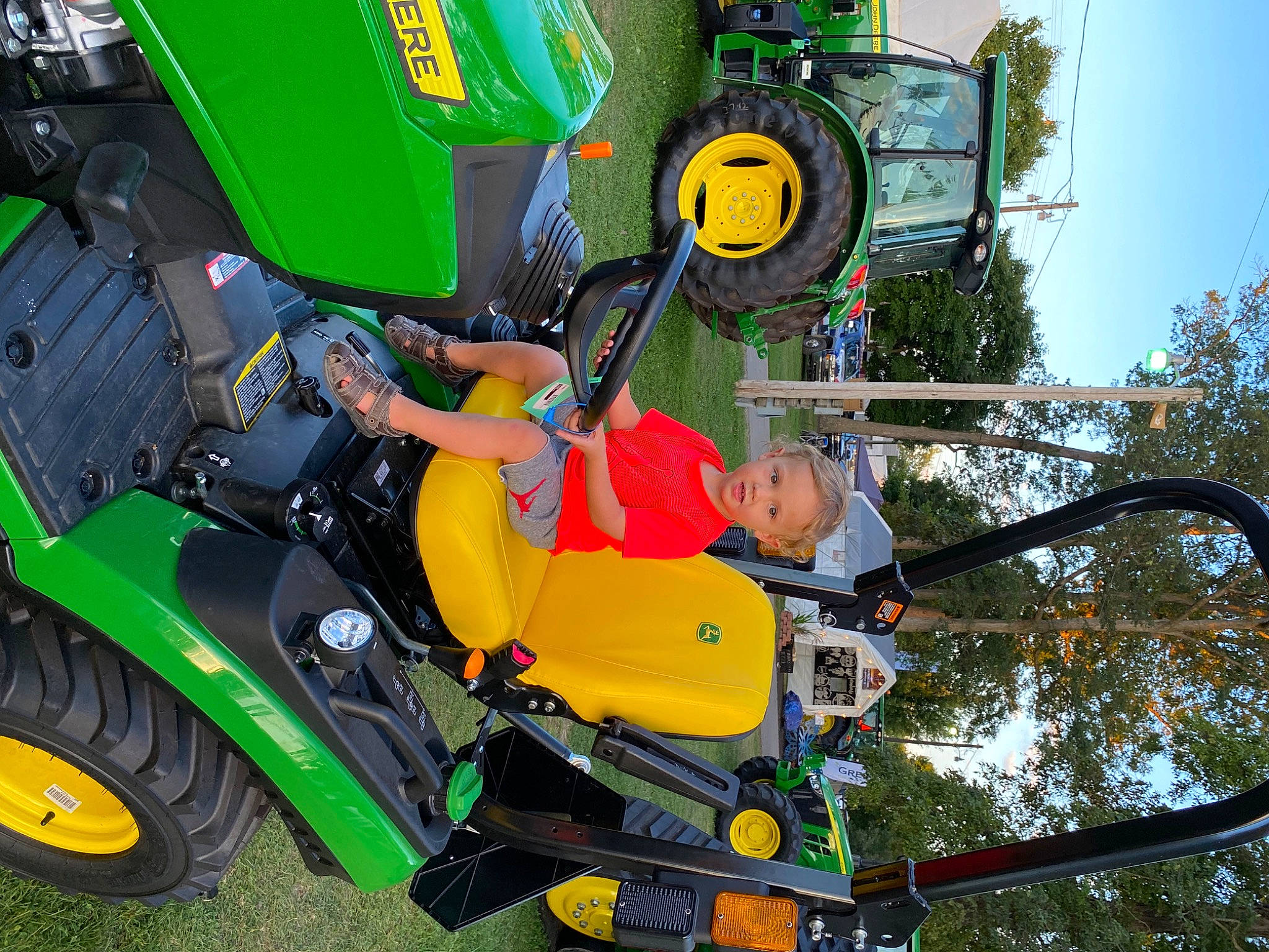 Braxton joined the competition — help win amazing prizes! agricultural_machinery, auto_part, automotive_design, automotive_exterior, automotive_tire, automotive_wheel_system, fender, fun, grass, green, leisure, motor_vehicle, person, recreation, sky, tire, tread, tree, vehicle, wheel