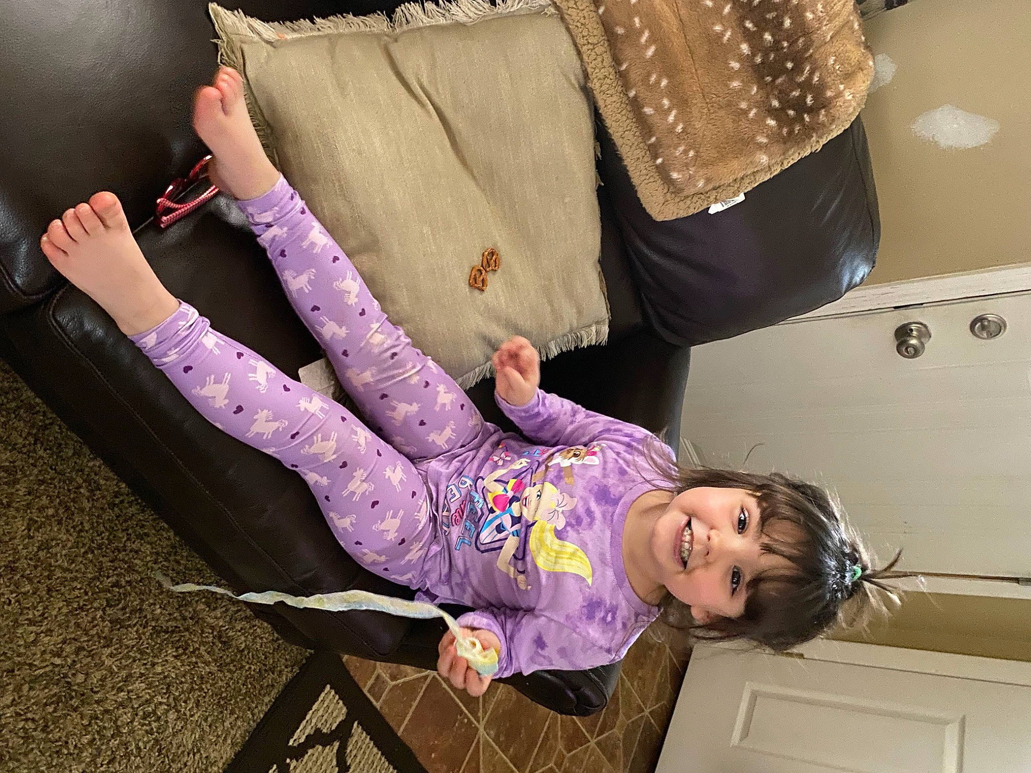 Avalynn is registered to the contest to win money with this photo: baby, baby_toddler_clothing, child, comfort, couch, drawer, eye, fashion_accessory, fun, fur, gesture, happy, human_leg, joy, magenta, person, purple, room, sitting, sleeve