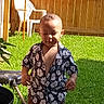 Zhyion Grant is registered to the contest to win money with this photo: backyard, boy, cake, child, clothing, cream, dessert, food, grass, icing, lawn, male, nature, outdoors, person, plant, shorts, summer, wood, yard