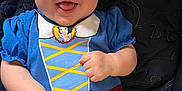 Mckenzie is registered to the contest to win money with this photo: baby, blanket, blue_clothing, child, closeup, cute, eyes, fabric, face, hands, happy, indoor, infant, lying_down, mouth_open, person, portrait, red_bow, smiling, yellow_skirt