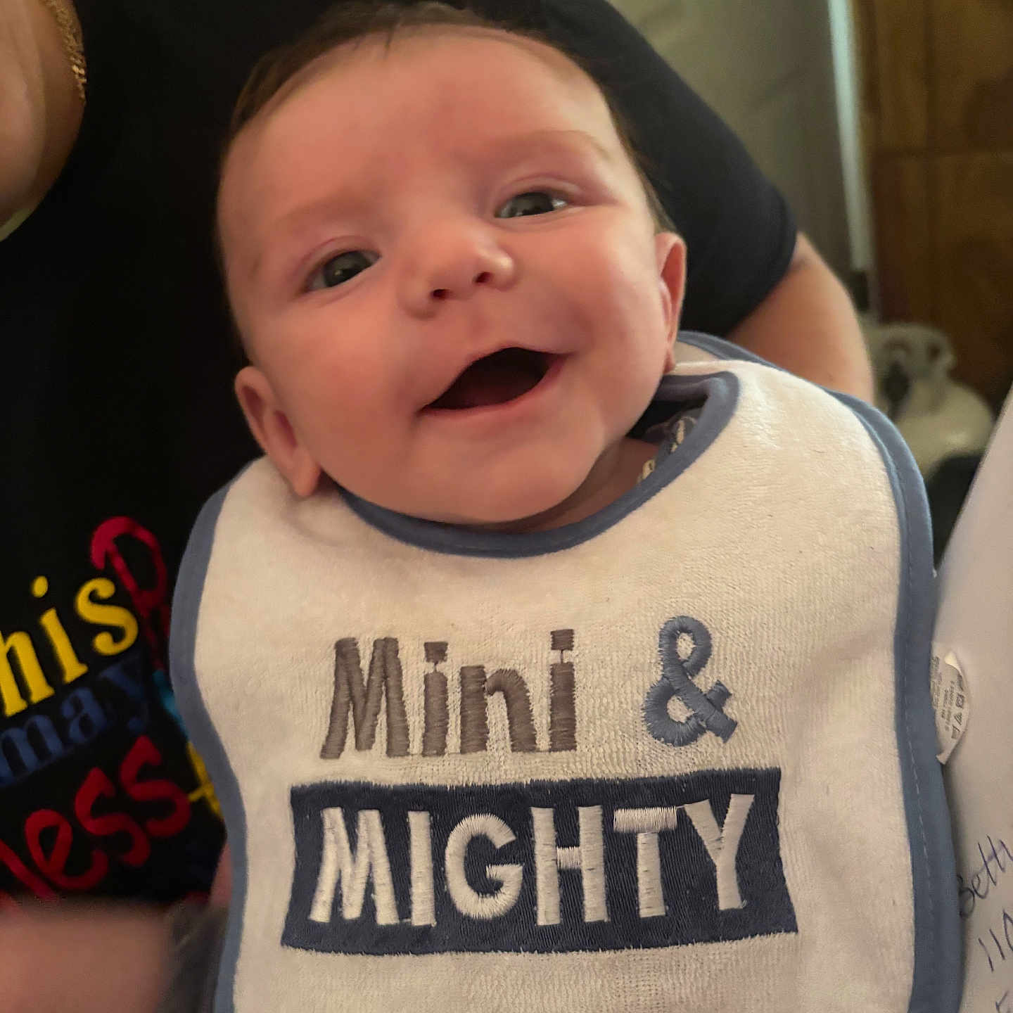 Adam is registered to the contest to win money with this photo: baby, bib, face, head, newborn, person, photography, portrait