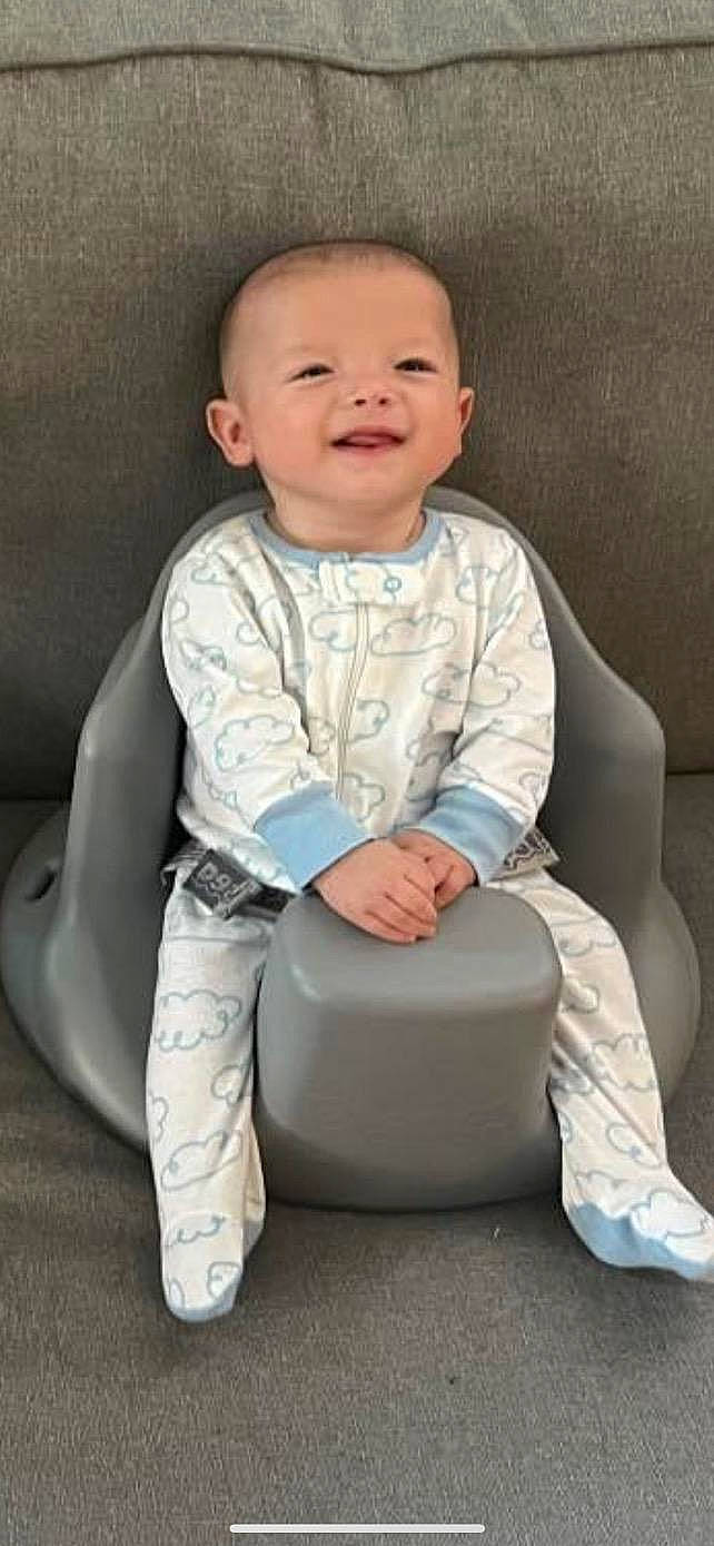 Austin is registered to the contest to win money with this photo: baby, baby_toddler_clothing, beauty, cheek, child, chin, comfort, face, facial_expression, flash_photography, happy, joy, knee, person, product, sitting, skin, sleeve, smile, t_shirt