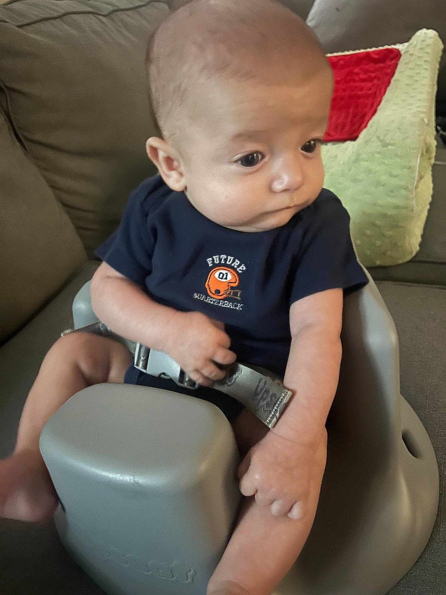 Austin is registered to the contest to win money with this photo: baby, baby_products, baby_toddler_clothing, car_seat, chair, cheek, child, comfort, elbow, fun, human_leg, knee, lap, person, sitting, sleeve, smile, sock, thigh, toddler