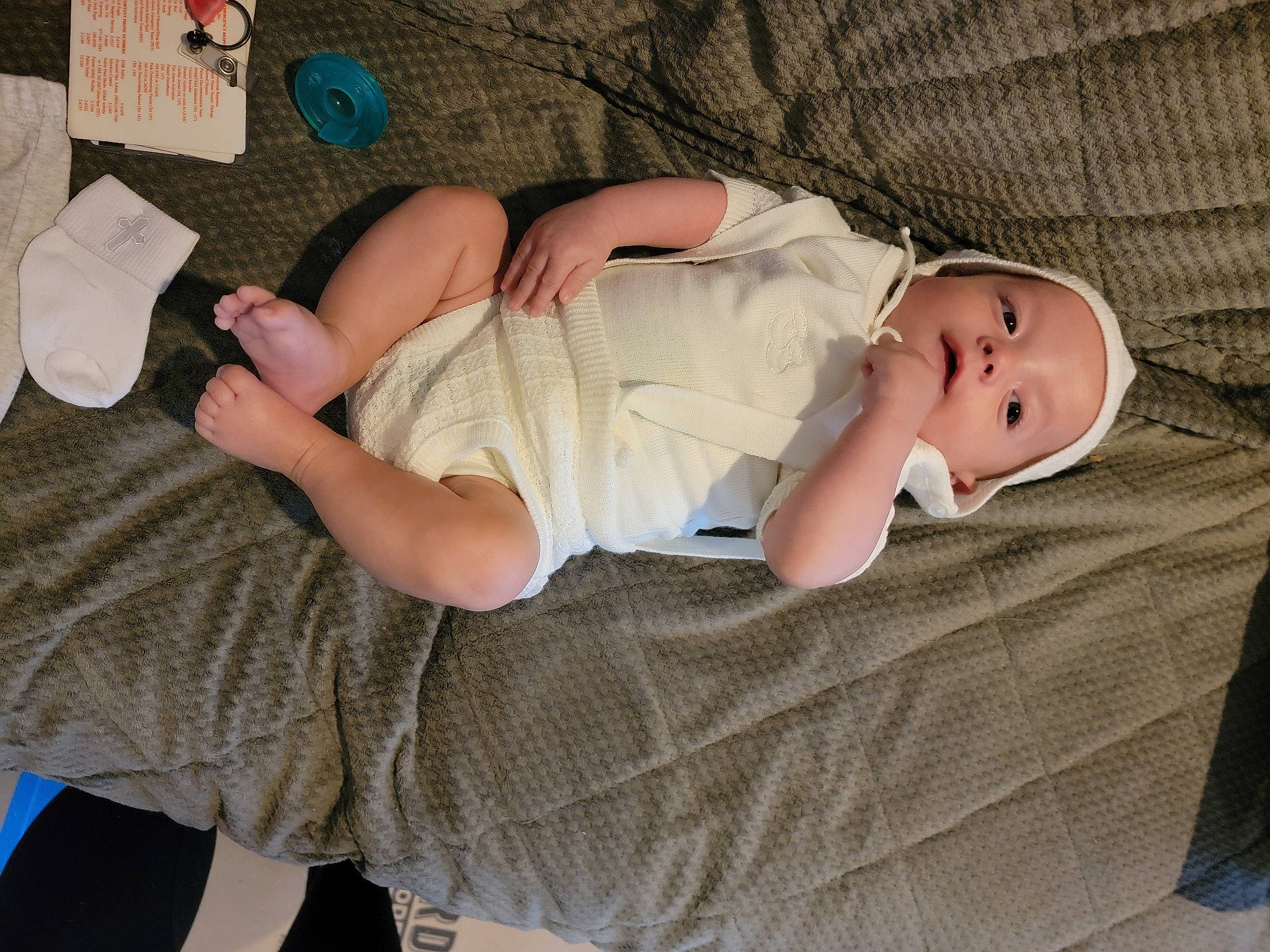 Austin joined the competition — help win amazing prizes! baby, baby_toddler_clothing, child, comfort, elbow, foot, glasses, hat, human_body, human_leg, joint, knee, linens, nap, pattern, person, room, sitting, thigh, toddler