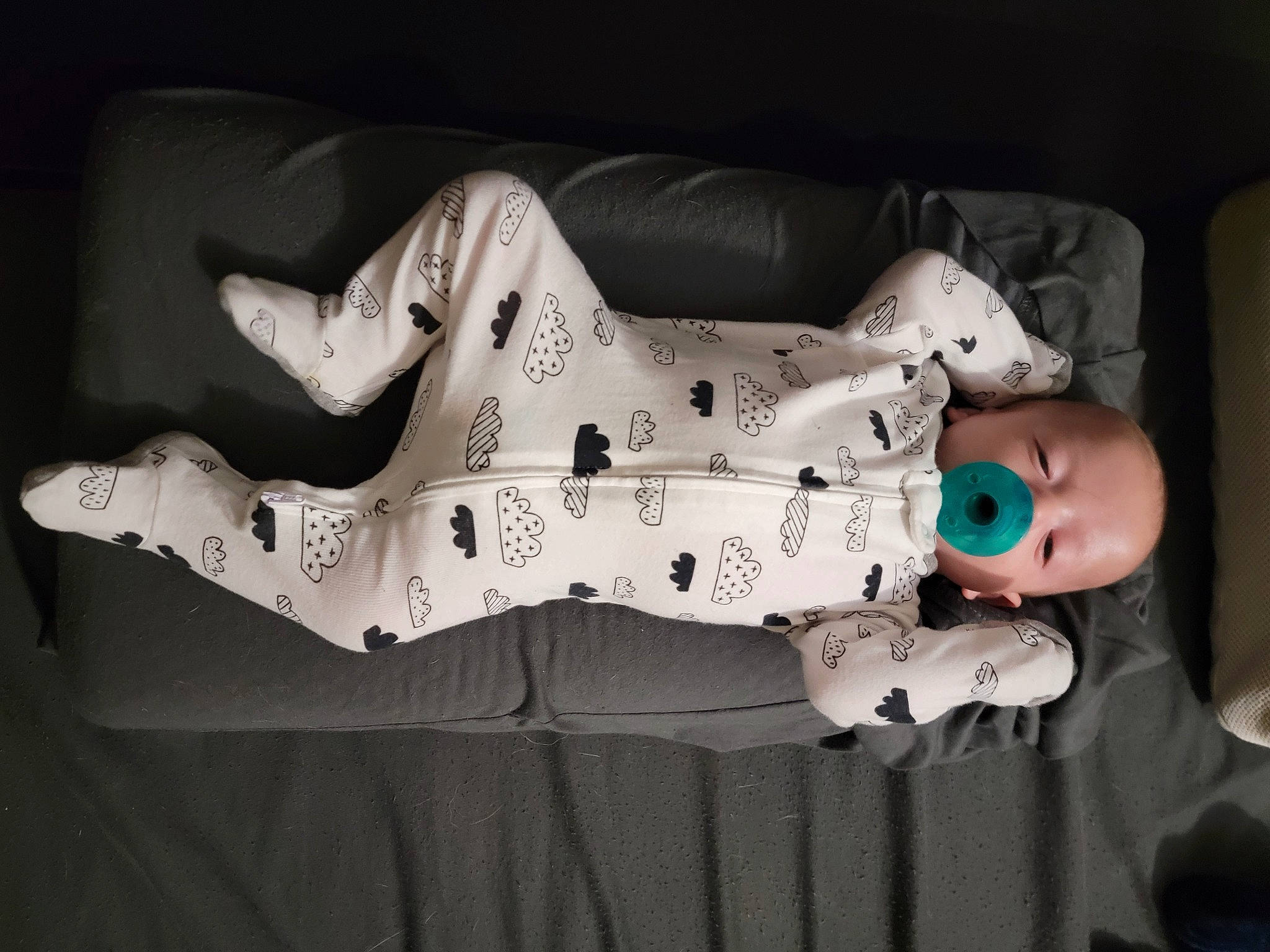 Austin is registered to the contest to win money with this photo: baby, baby_products, baby_toddler_clothing, carmine, child, comfort, darkness, dress, elbow, flash_photography, foot, human_body, human_leg, leg, monochrome_photography, pattern, person, sitting, sleeve, thigh