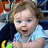 Leonard joined the competition — help win amazing prizes! baby, child, blue_eyes, plush_toy, stroller, clothing, happy, smiling, indoor, furniture, person, cute, infant, toy, hand, face, hair, expression, bicycle, background