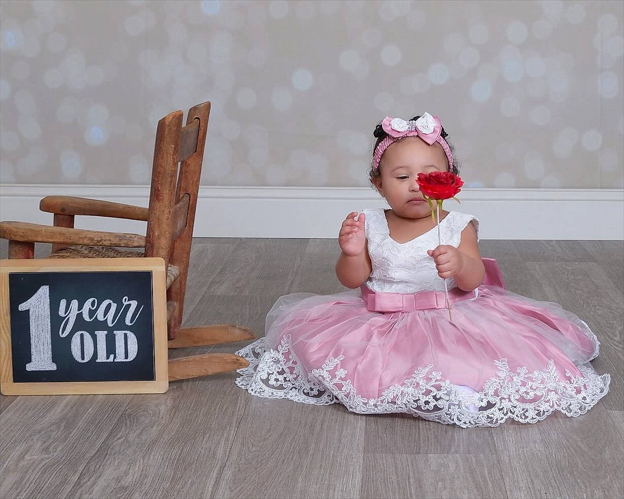 Tahani is registered to the contest to win money with this photo: baby, baby_toddler_clothing, ballet_tutu, chair, child, day_dress, dress, embellishment, event, fashion_accessory, hair_accessory, happy, headgear, headpiece, magenta, person, pink, ruffle, sleeve, toddler