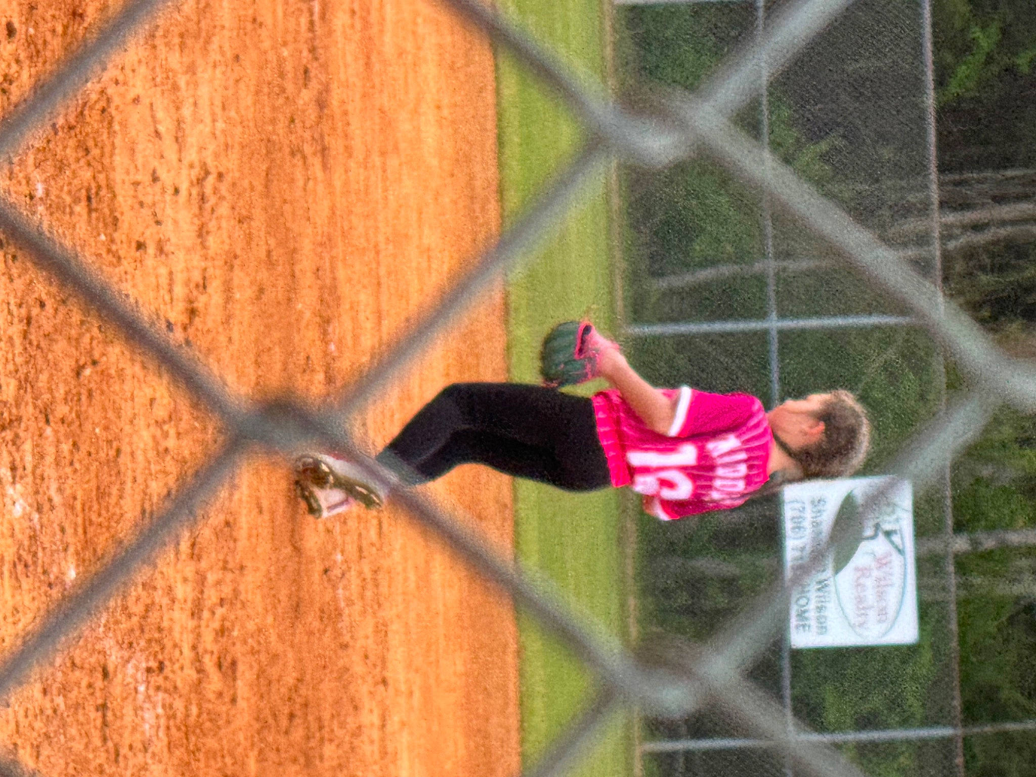 Madison joined the competition — help win amazing prizes! baseball, chain_link_fencing, competition_event, fence, fun, grass, leisure, mesh, net, person, plant, player, recreation, shorts, softball, sport_venue, sports, team_sport, tree, wire_fencing