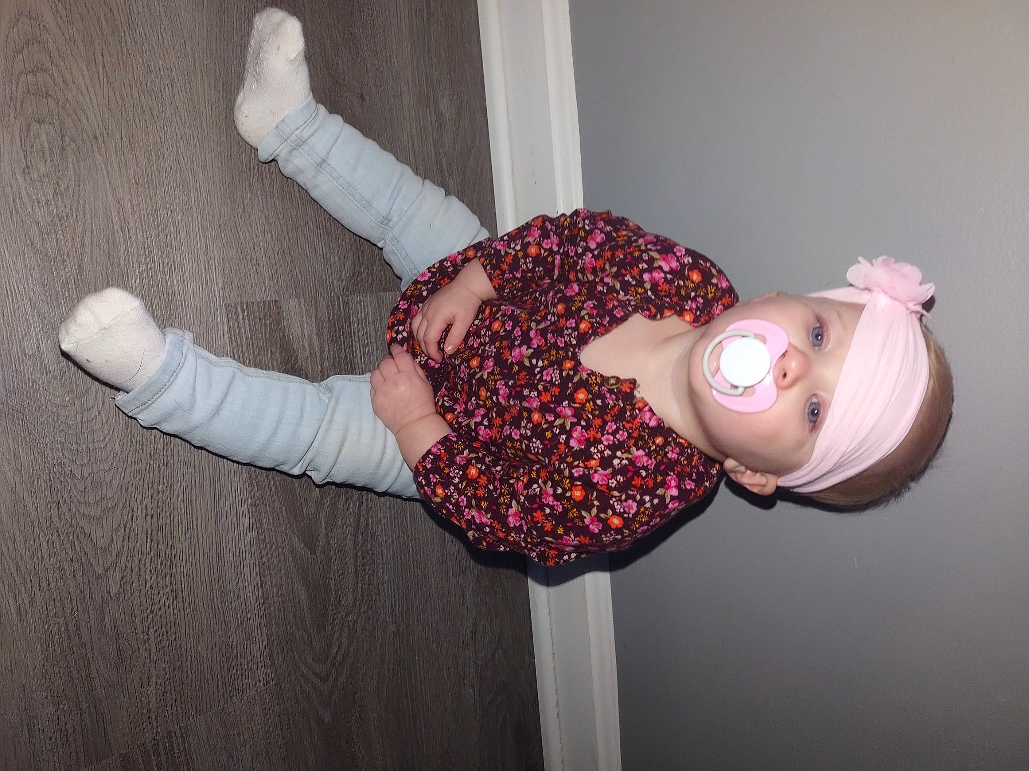 Everly is registered to the contest to win money with this photo: arm, baby_toddler_clothing, child, elbow, fashion_accessory, finger, headwear, human_leg, joint, knee, magenta, pattern, person, pink, room, sleeve, sock, textile, thigh, toddler