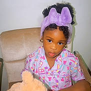 Dior joined the competition — help win amazing prizes! child, pajamas, headband, teddy_bear, chair, indoor, cute, portrait, cross-legged, toy, pink, purple, expression, sitting, young, person, smile, hair, fashion, home