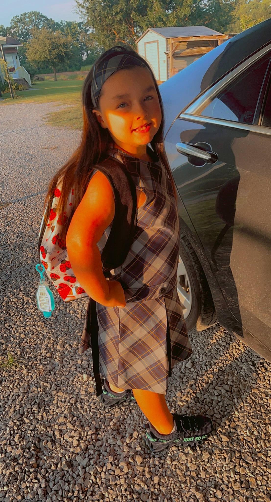 Jaylee is registered to the contest to win money with this photo: automotive_exterior, dress, fashion_design, fun, hair, headwear, hood, luggage_and_bags, person, personal_luxury_car, plaid, plant, recreation, shoe, street_fashion, tartan, thigh, tints_and_shades, tree, trunk