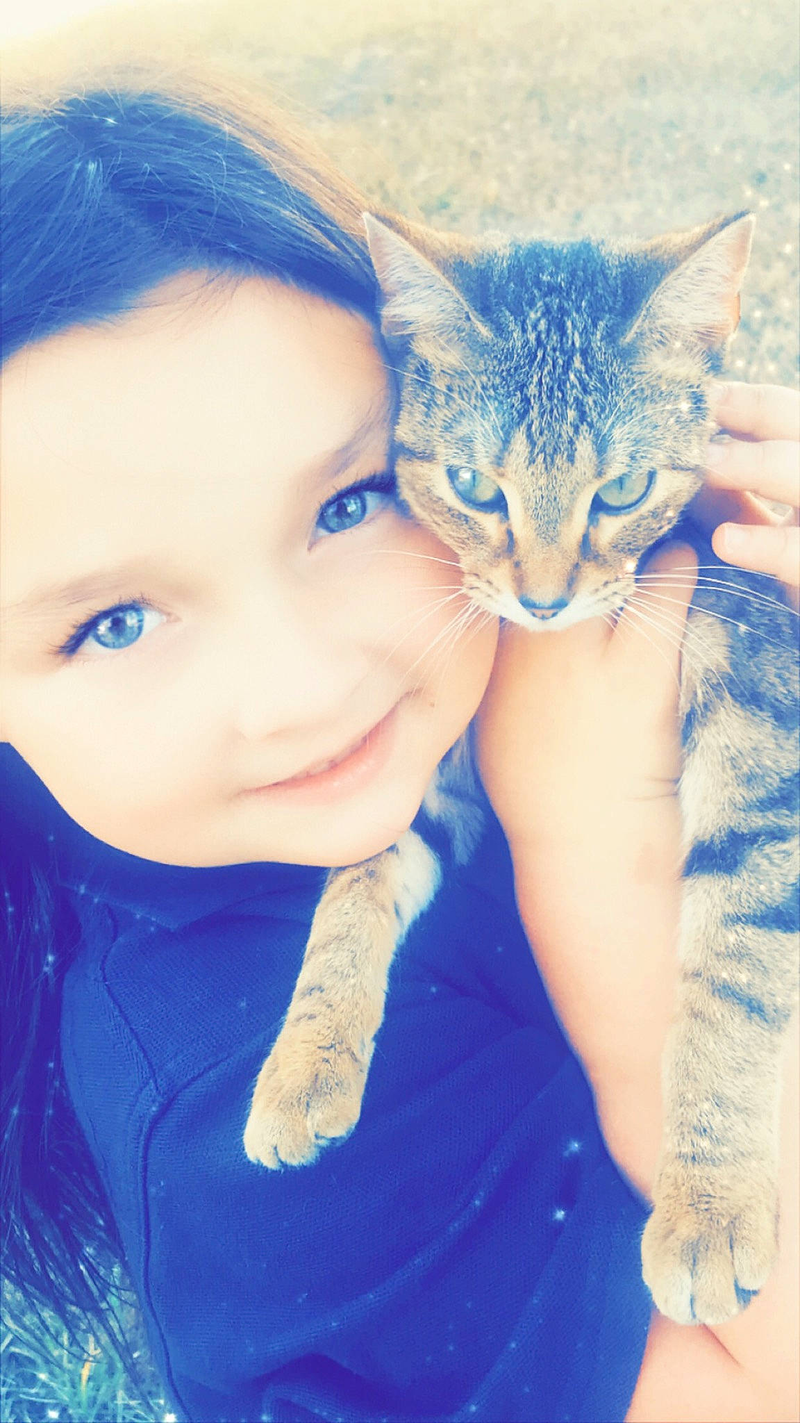 Jaylee joined the competition — help win amazing prizes! azure, blue, carnivore, cat, child, close_up, electric_blue, felidae, fur, gesture, grass, hair, hand, happy, iris, joy, person, plant, small_to_medium_sized_cats, smile