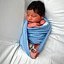 Esteban is registered to the contest to win money with this photo: newborn, baby, swaddled, blue_blanket, sleeping, infant, white_bed, peaceful, tiny_feet, hospital_band, soft_texture, portrait, cute, resting, child, human, wrapped, fresh, small, cozy