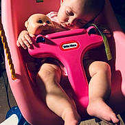 Lakelynn joined the competition — help win amazing prizes! baby, sleeping, swing, pink, doll, toy, child, indoor, legs, feet, face, toddler, seat, rope, wooden_floor, plastic, childcare, quiet, rest, peaceful