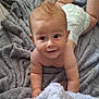 baby, infant, diaper, blanket, crawling, smile, face, skin, hair, child, cute, indoors, soft_texture, happy, playful, person, young, expression, floor, toddler