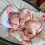 Sylvia is registered to the contest to win money with this photo: baby, sleeping, infant, mittens, pink, floral_pattern, bassinet, blanket, cozy, soft, pastel, cute, foot, hand, face, peaceful, rest, newborn, clothing, indoors