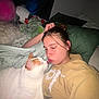 Bella joined the competition — help win amazing prizes! person, cat, bed, pillow, stuffed_animal, white_cat, orange_cat, indoor, cozy, kiss, sleepwear, blanket, relaxation, cute, pet, animal, human, portrait, rest, affection